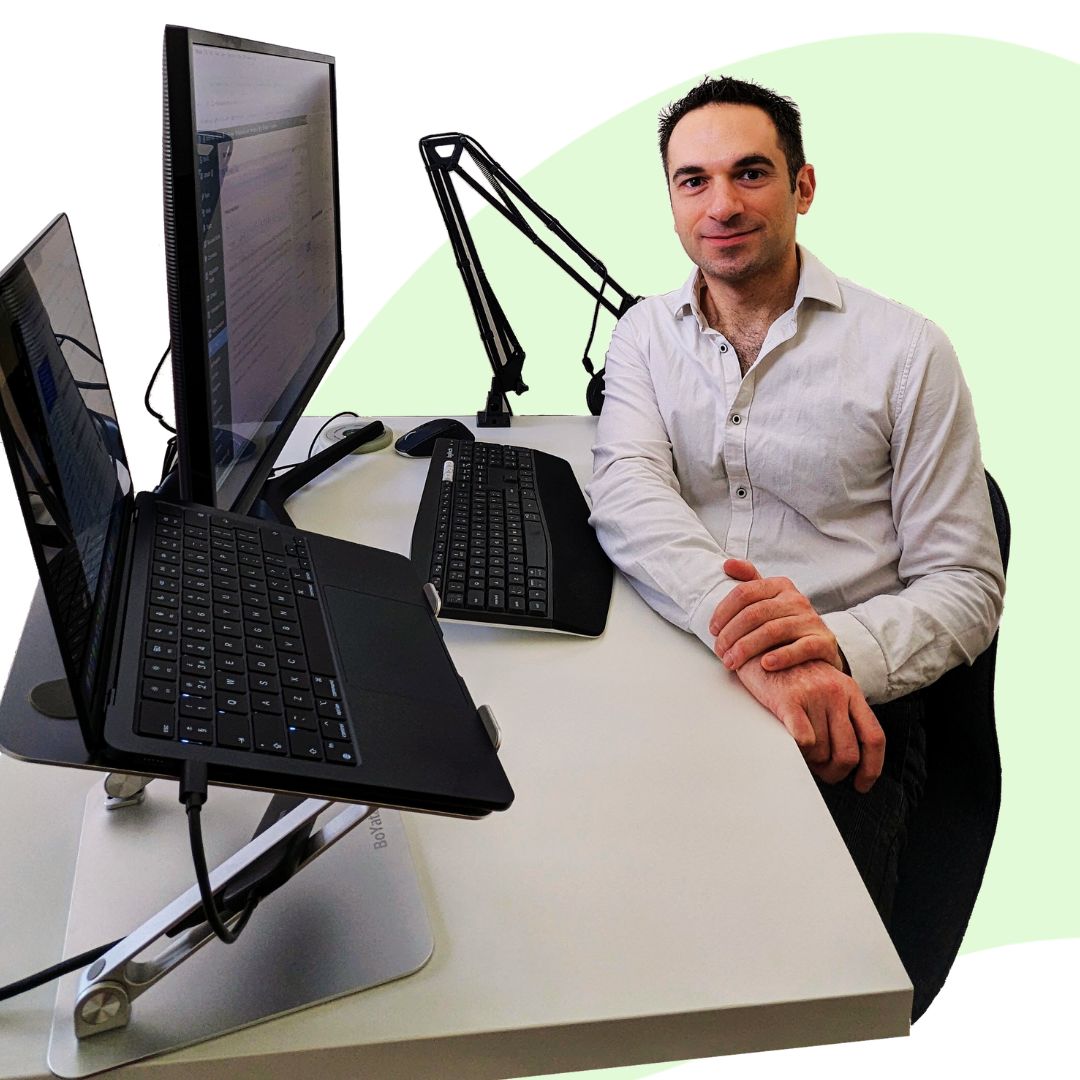 An e-commerce admin support sitting at his desk