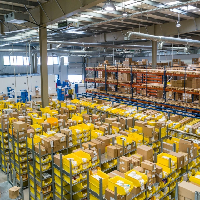 A warehouse full of products ready to sell online thanks to the services of a freelance e-commerce manager