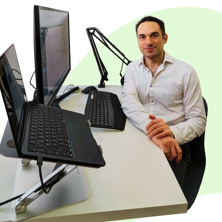 A picture of Pietro Riccio at a desk working as an e-commerce admin support specialist